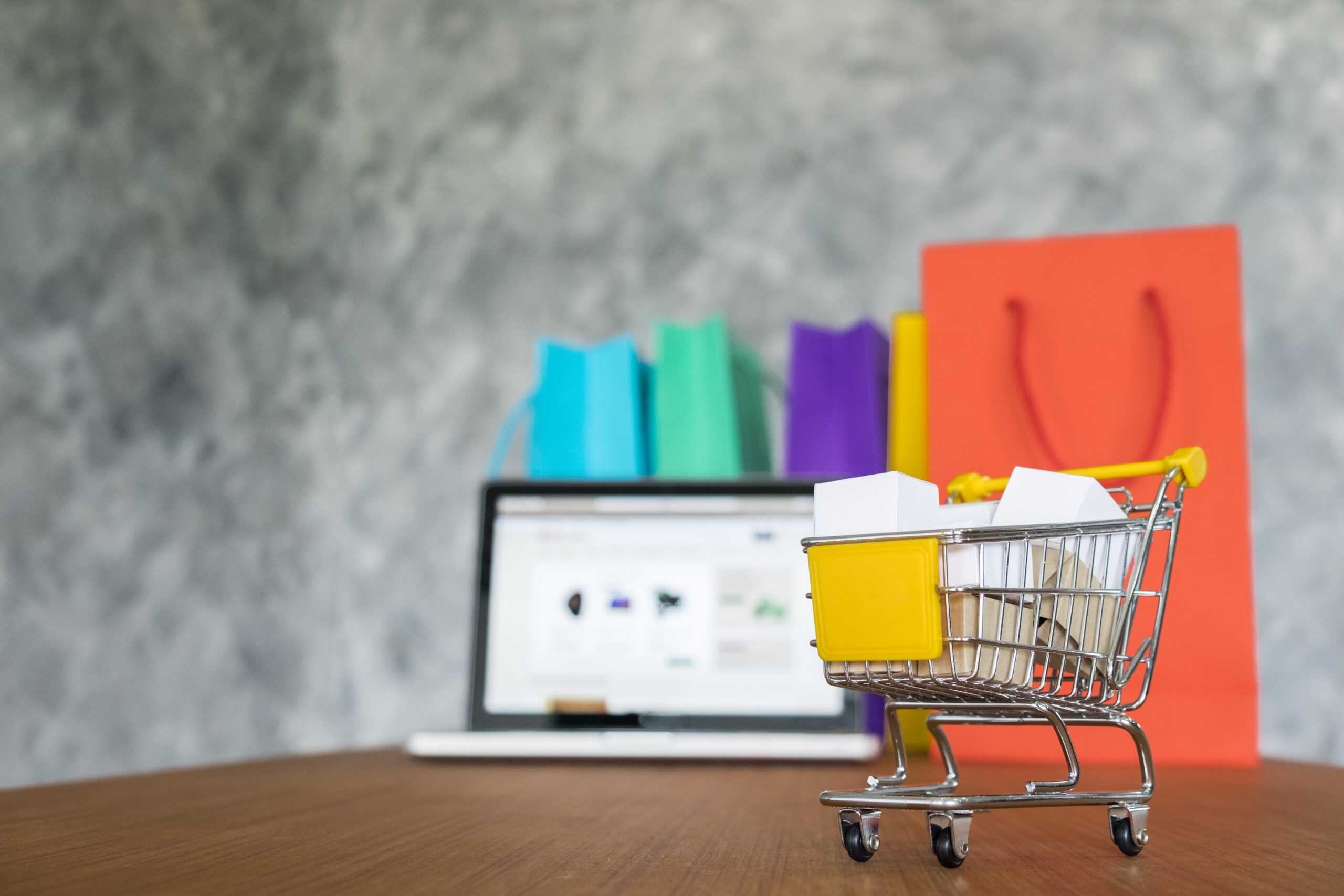 laptop and shopping bags, online shopping concept.